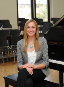 Jennifer Stadler by the piano