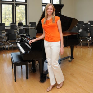 Jennifer Stadler by the piano